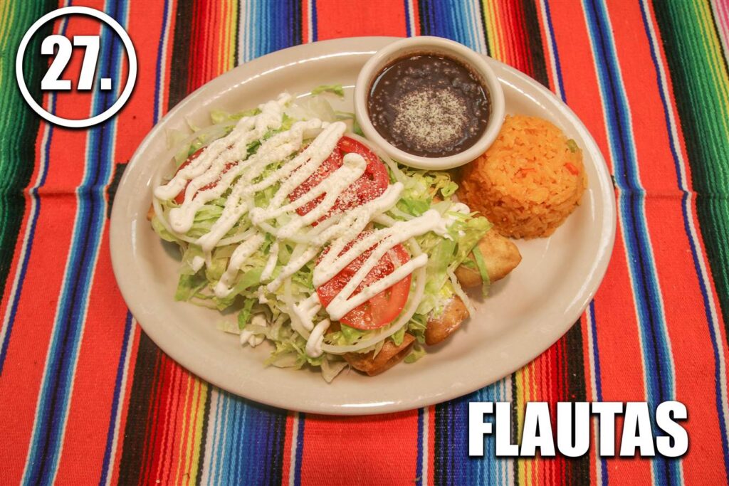 A plate of food with salad and bread on it.